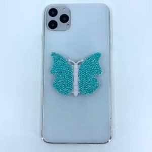 White butterfly phone stand grip with teal rhinestones.